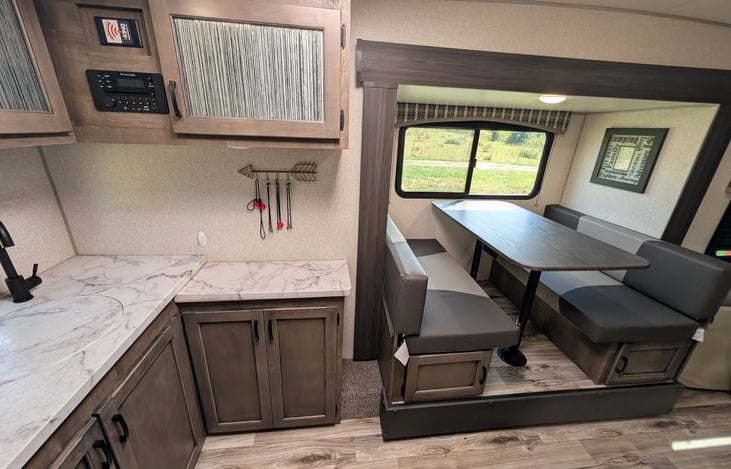 Smart layout featuring a chef’s rear galley and a slide-out dinette with a huge panoramic window. Enjoy great meals, natural light, and scenic views in a surprisingly spacious interior!