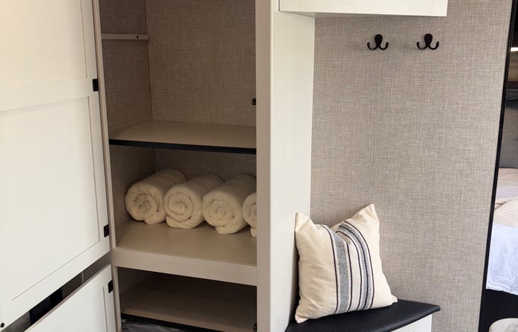 Storage. Bath towels, fan, comforter, extra sheets, hand and face towels provided.