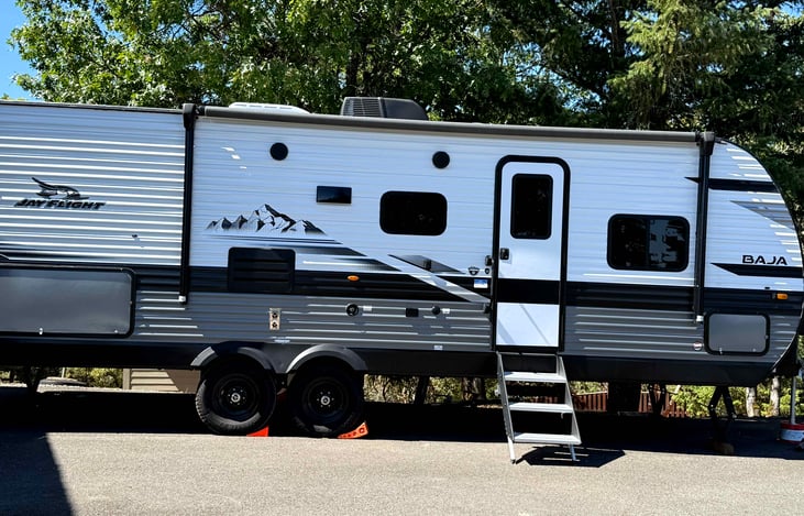Sturdy stairs with hand rail and wheel chalks.