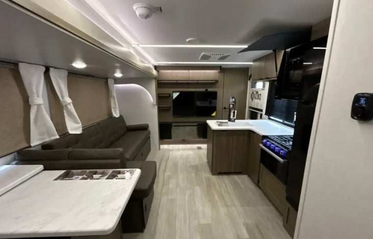 Living area with adjustable seating.  Big screen makes rainy days a little more enjoyable.