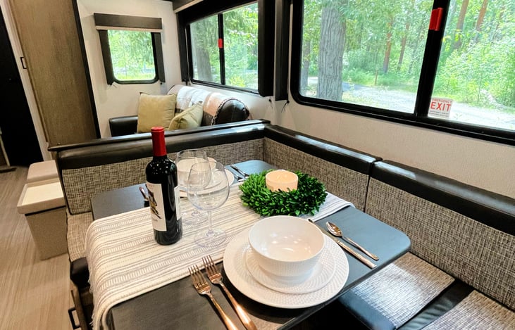 RV includes modern dish set and cutlery plus decorative touches to make you feel at home.