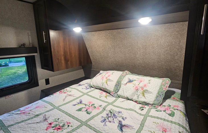 The short queen bed has a gel foam mattress  for extra comfort and a private tv