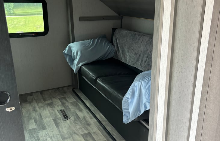 Bunk house couch folds to full sized bed and another twin above for small children only.