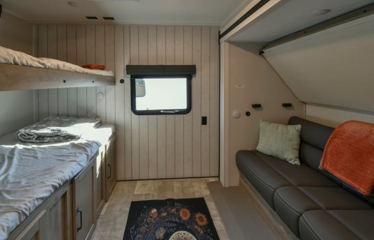 Bunkroom with jackknife couch that folds out. The bunkroom can sleep 5