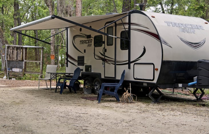 hard rock platform , with comfortable seating under the pull out awning, 'deep woods', but luxury, fresh delish well water