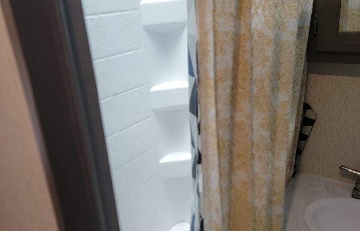 Shower with bathtub.