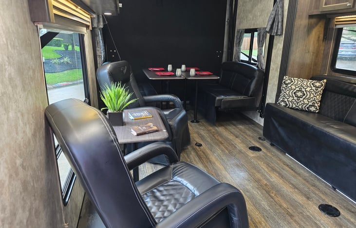 Relax in the captains chairs with a great view out window.