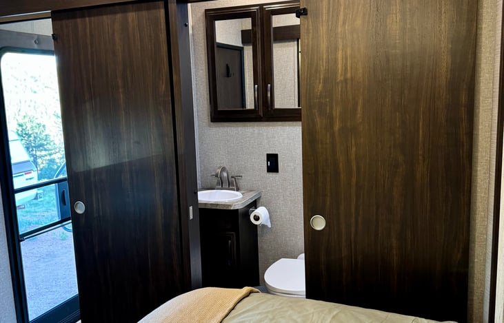 A full bathroom with Jack and Jill doors offers access from the bedroom and also from the living area. The bathroom has a full size shower and a fully stocked medicine cabinet for your convenience