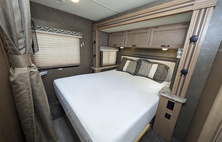 Queen size bed with TV and storage