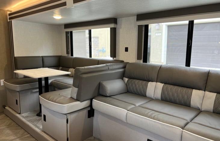Comfortable couch and dinette area that has multiple ways it can connect together. Dinette can shorten and couch lengthen into a chase lounge in evening when your'e ready to relax to tv