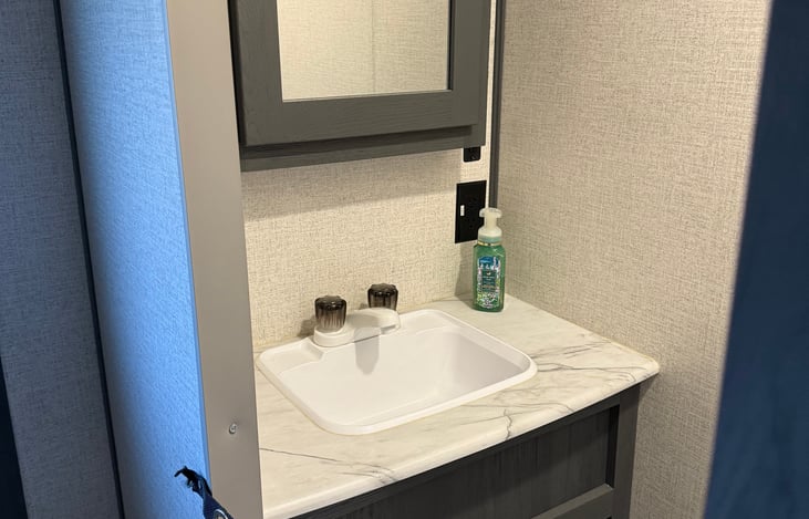 Master bath sink. Hand soap available. Toilet right across. Fresh hand towels available upon request.