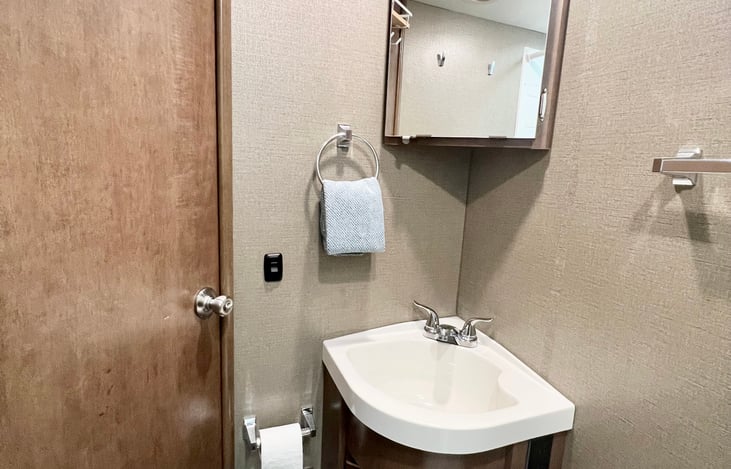 Medicine cabinet with first aid kit and deep bathroom sink