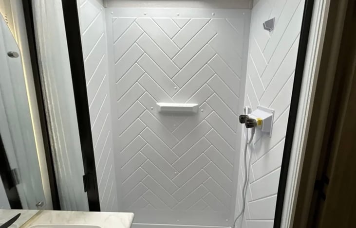 Large shower with on demand tankless hot water.