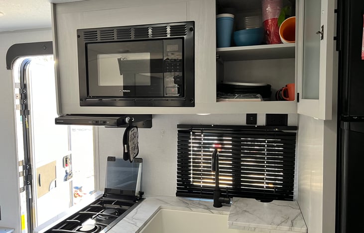 Cups, Plates, Coffee mugs and more included in kitchen cabinets