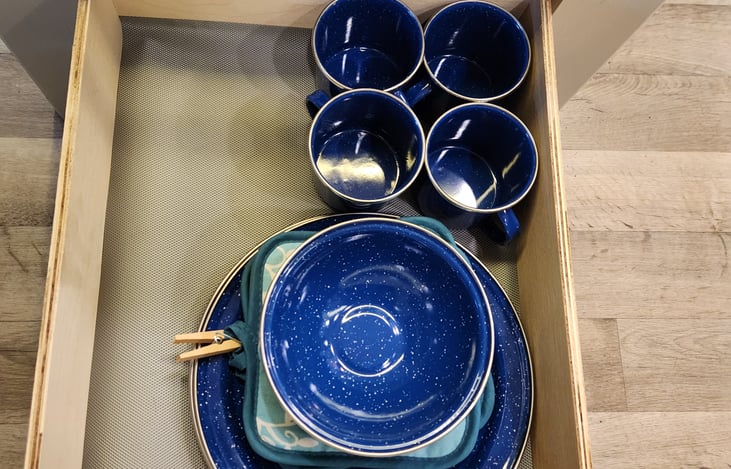 Camping grade enamel dining set included with rental (includes plates, bowls and mugs for 6)