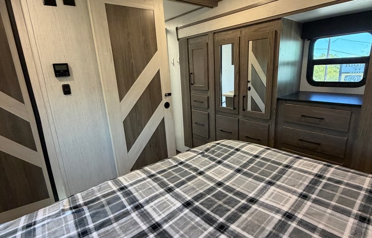 Rest and recharge in your private queen bedroom, complete with fresh linens and a comfortable space to unwind.