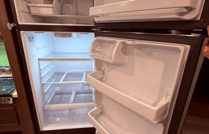Stainless Steel residential size refrigerator/freezer.