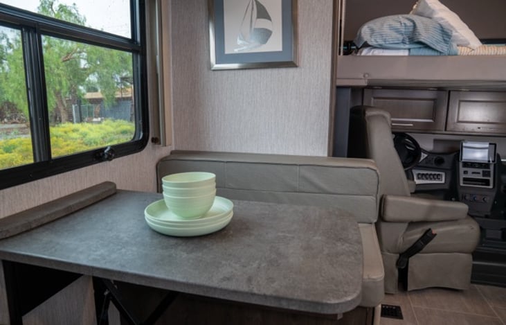 4 seater dinette easily converts to a twin sized bed for additional sleeping.