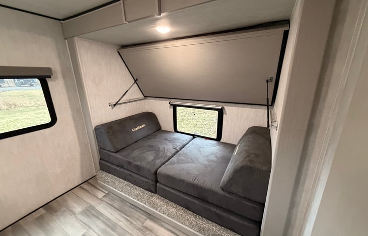 Convertible dual lower beds into a sitting couch for kids to watch TV and play on those rainy days. Very large play area. Upper bunk folds up during day for more room.