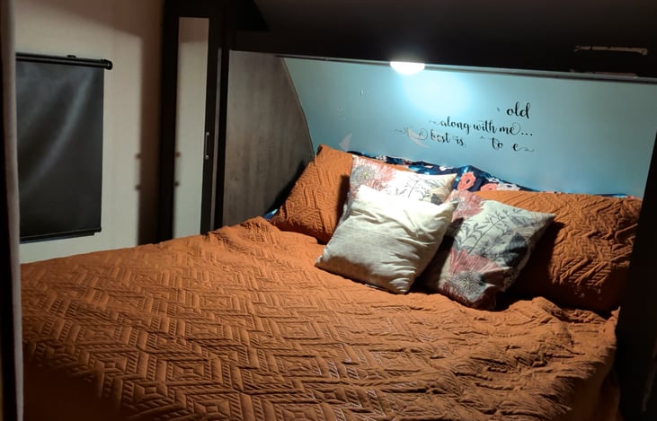 Private screened off bedroom with plush queen size bed. Pillowtop Bed has standard coils, and is not too hard, and not too firm.