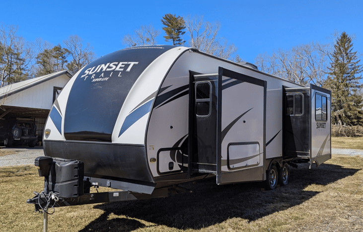 Luxury 30' triple-slide trailer with a gourmet rear kitchen & private master suite. Massive open-concept living and theater seating—the ultimate upscale home on wheels for your next getaway!