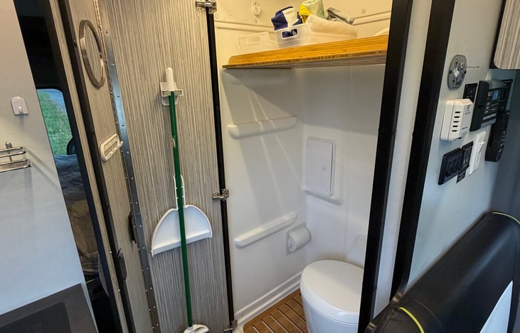 wet bath area includes shower, toilet, and storage