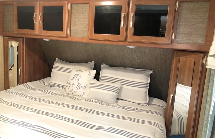 Oversized Queen Bed and Storage above