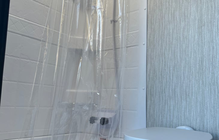 Full shower and small bath tub.