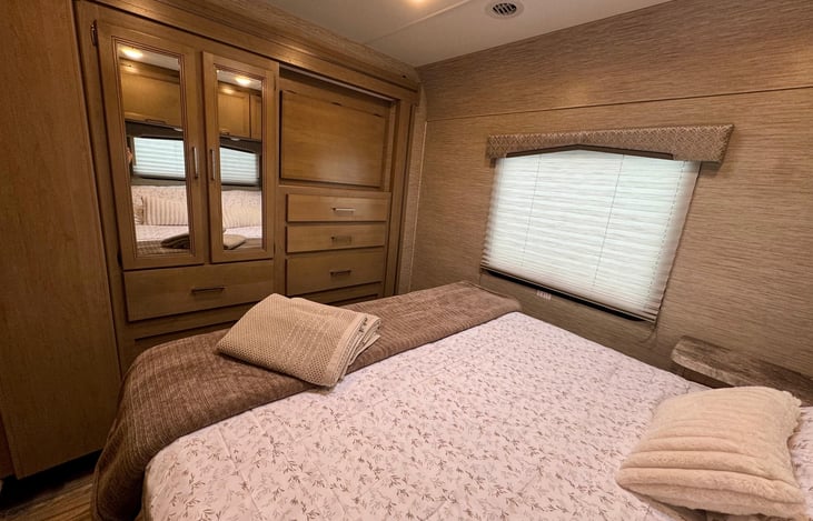 Master Queen Bed: Enjoy the comfort of a queen-sized bed in a private sleeping area, perfect for recharging after a day of adventure.