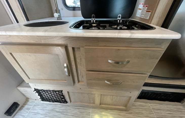 Whether simmering a stew or preparing breakfast, this stove top combines functionality and style for your travel adventures.