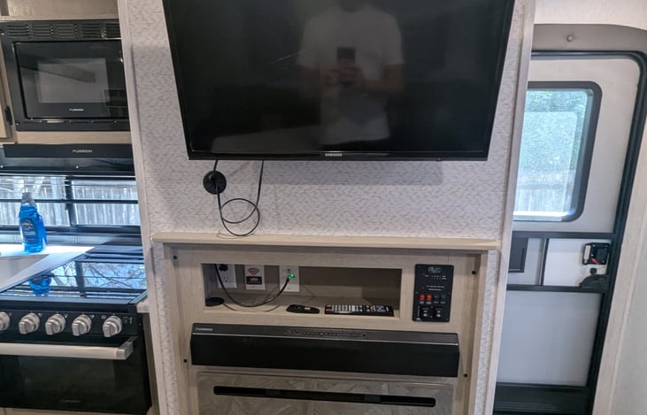 TV w/sound bar and fireplace