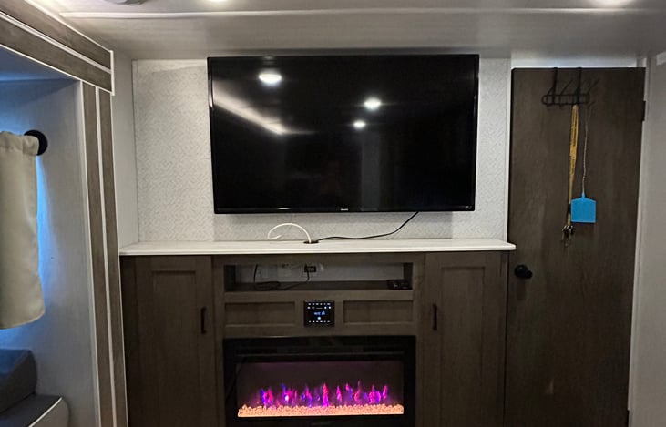 fireplace, tv and entertainment center.
