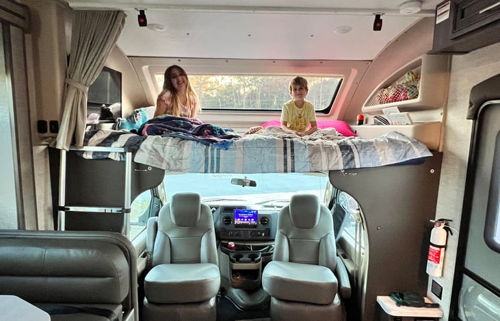 Our kids LOVE the loft area, but even an adult (or two) would fit nicely.  The captains chairs spin around to provide more indoor sitting.