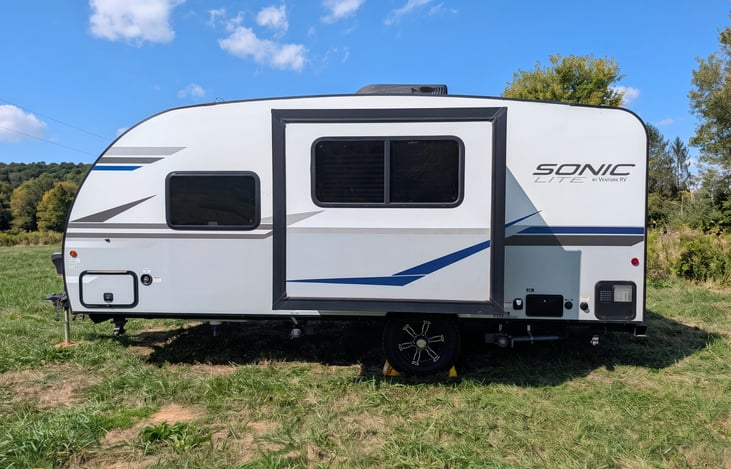 Easy-tow 2022 Venture Sonic Lite (3,600 lbs)! Features off-grid solar, all-terrain tires, slide-out, spacious rear kitchen, queen bed & power awning. Perfect couple's getaway for any adventure!