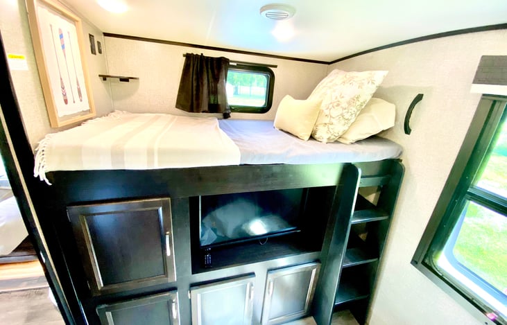 bunk room with 3rd television