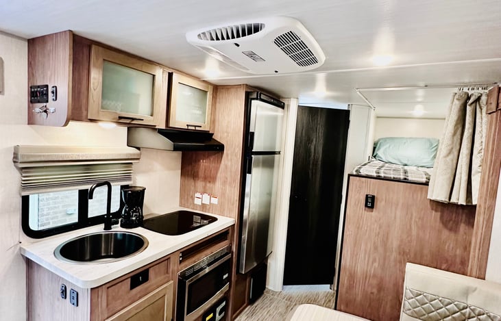 Full kitchen includes plates, bowls, cups, silverware. Also grill cooking spatula and brush for grill cleaning. Bottom cabinet includes small cleaning items. Coffee pot for the morning brew!