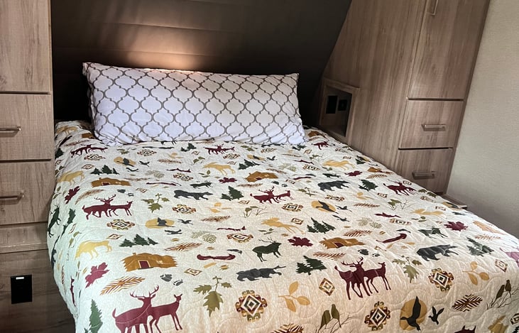 Queen sized bed with room to walk on both sides.