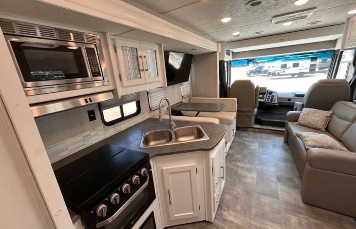 Kitchen/living area with large TV