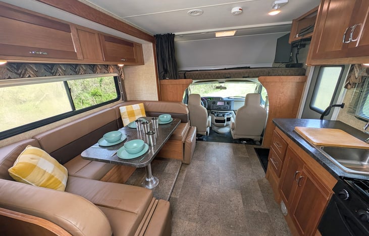 Cozy and spacious floor plan will ensure everyone is comfortable in this RV. Fully stocked kitchen, plenty of storage, swiveling captain's chairs and more.