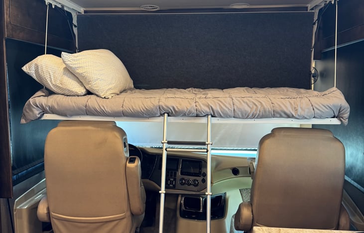 Twin bunk with ladder. Max weight capacity 200#. Separate lights above bunk.