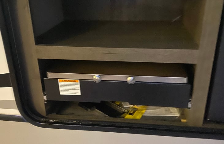 Outdoor kitchen grill with top storage