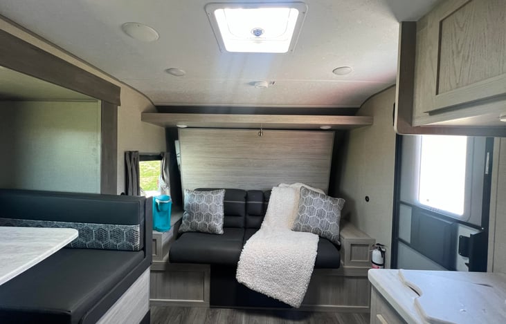 Murphy bed turns into a couch for additional seating.