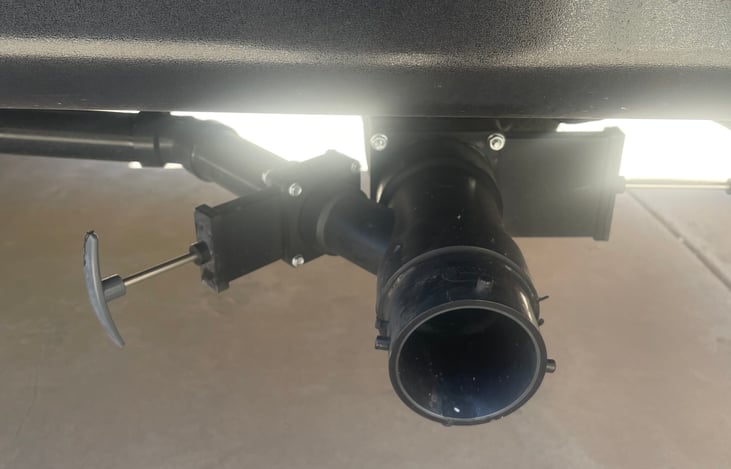 Gray/black water tanks drain with open/shut handle. New, includes cover, New