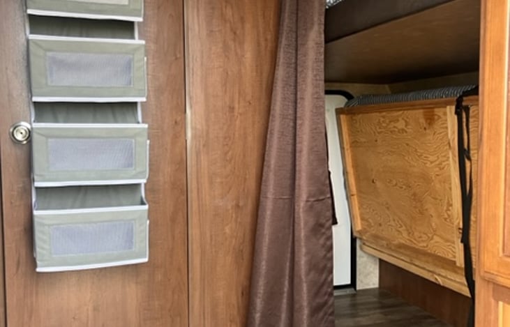 Front lower bunk folds up for storage.