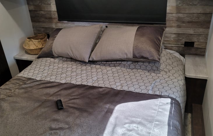 King bed in the master with mattress and pillow protectors.