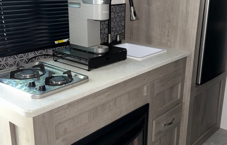 Kitchen includes coffee maker and basic supplies