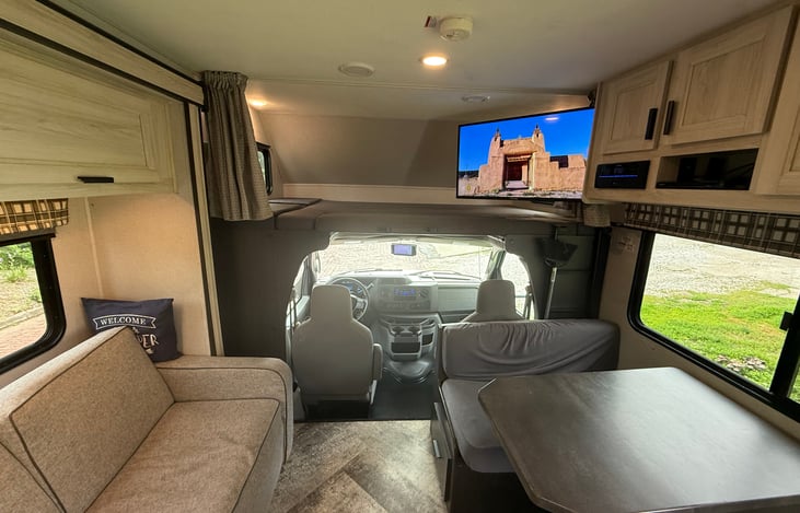 Living room with 12 volt TV on (generator is not required) HDTV antenna is provided on the roof.