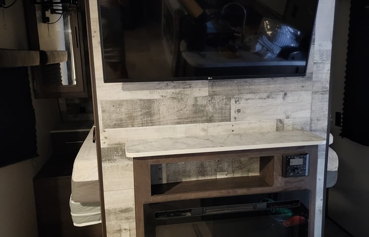 Flat screen with roku and gas fireplace