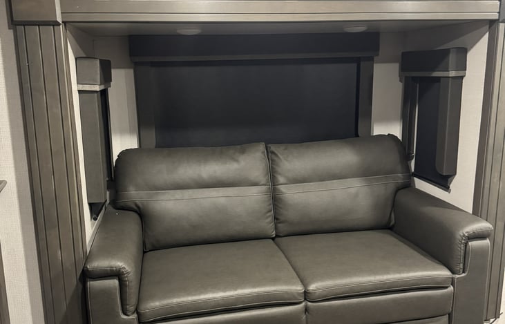 Living room sofa with hidden bed. One exactly like it on other side of room.