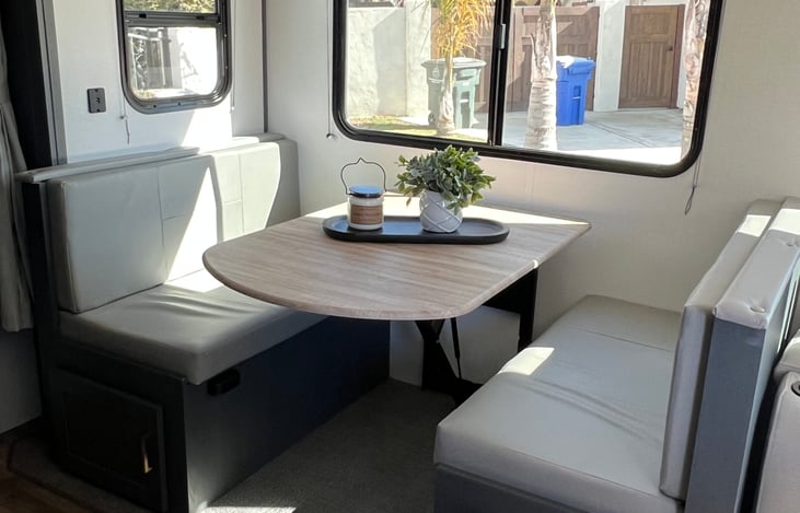 Dinette comfortably seats 4 and can be converted into a bed.